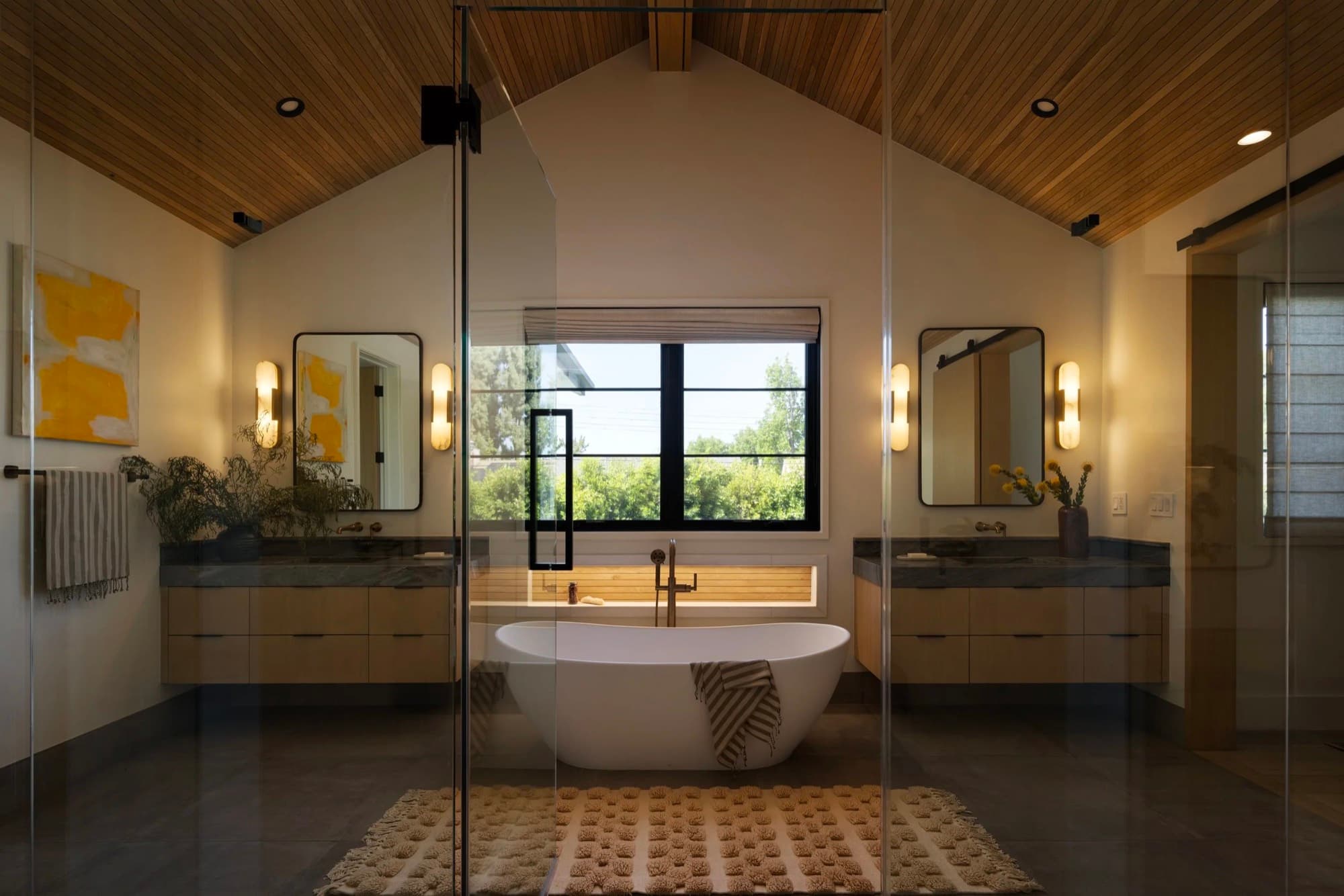 A pair of abstract works placed in a private bathroom