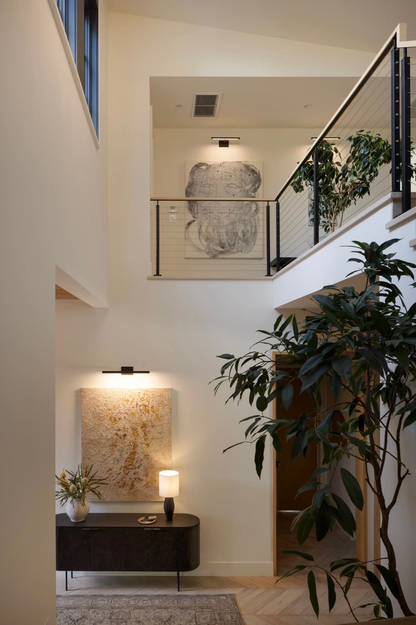 Two contemporary works placed across a double-height stairwell