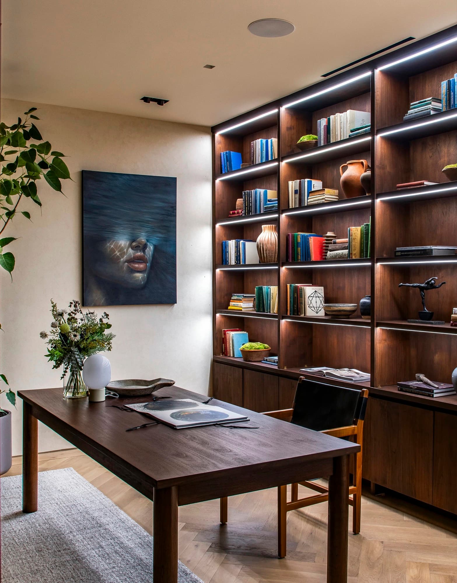 A contemporary portrait placed in a private study